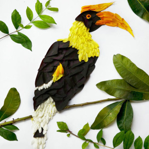 Red Hong Yi, hornbill made of chrysanthemums, germeras and purple shamrocks